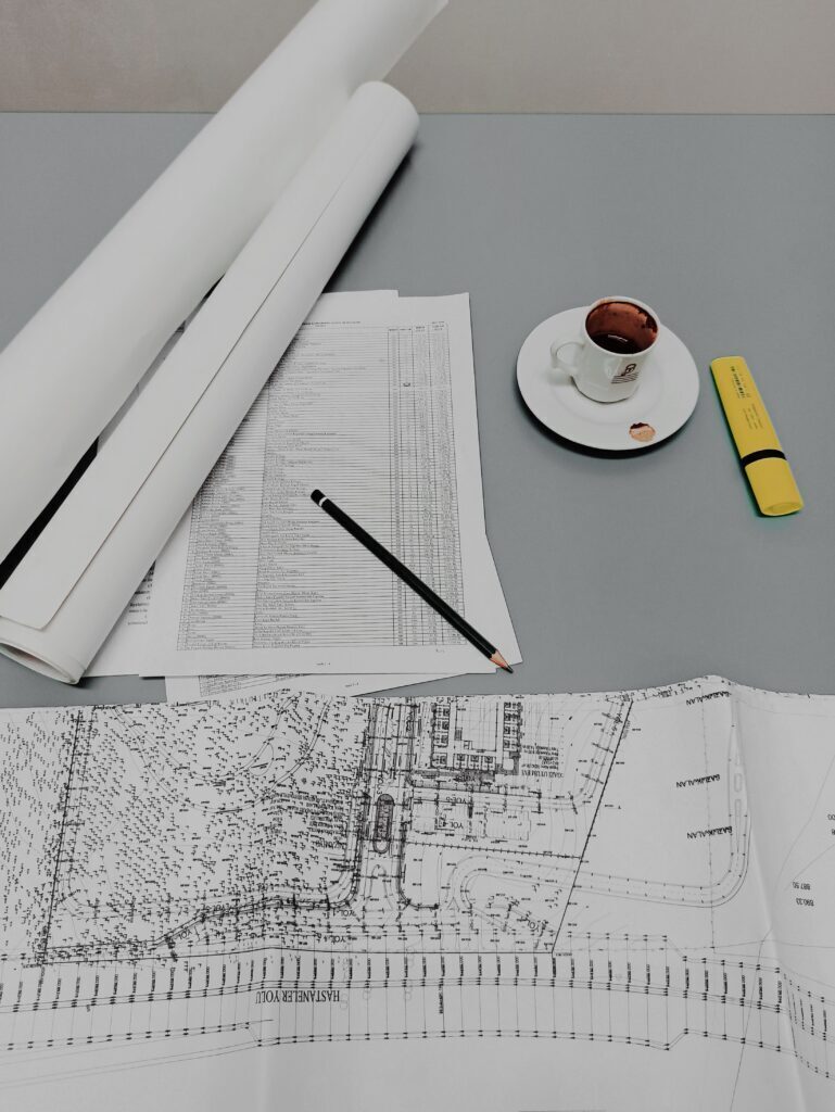 Due Diligence & Project Planning Plans on a desk