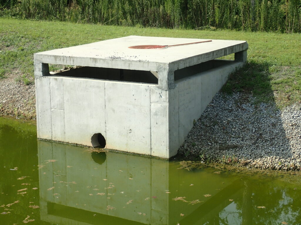 An outlet control structure in a retention basin
