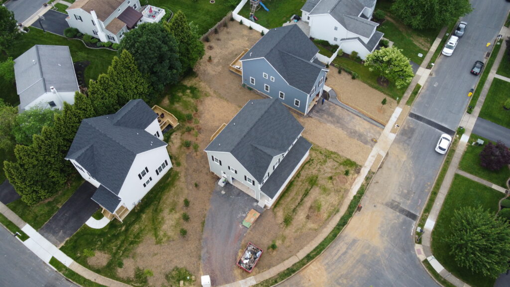 An aerial view of three new houses